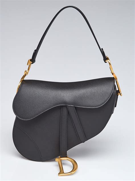 black christian dior saddle bag.